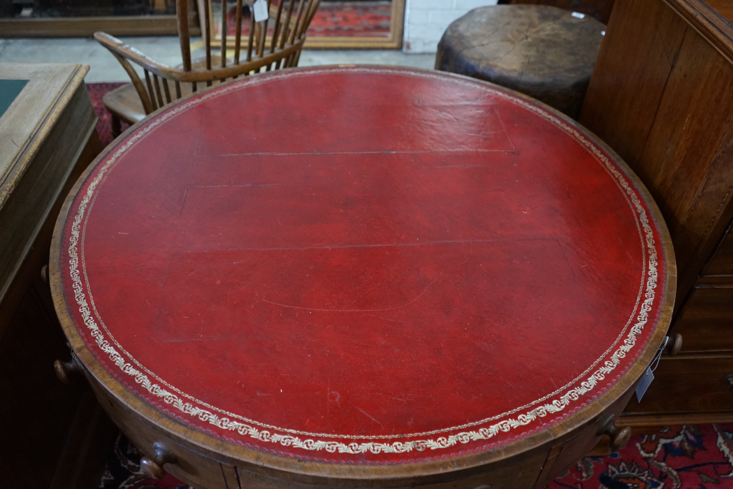 A 19th century circular drum table, diameter 106cm, height 74cm